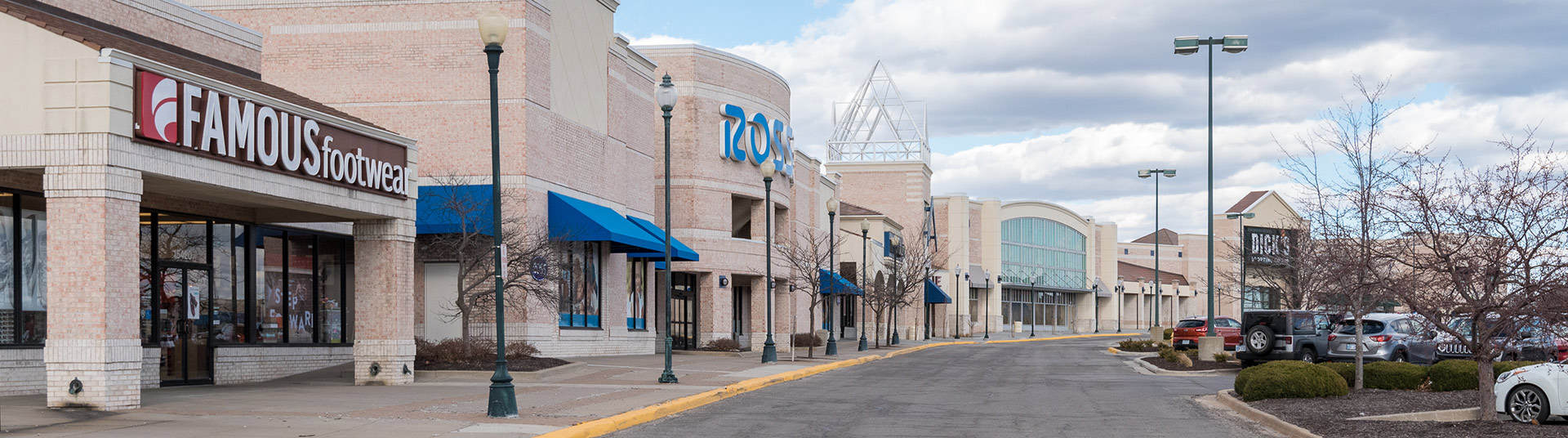 A strip mall featuring Famous Footwear, Ross, and Dick's Sporting Goods
